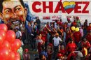 People attend a campaign rally by Venezuela's President Chavez, who is seeking re-election in an October 7 presidential vote, in Guarenas
