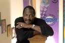 FILE - In this Dec. 8, 2003 file photo, Mathew Knowles, father and former manager of singer Beyonce Knowles, poses at his Music World Entertainment headquarters in Houston. Knowles married former model Gena Charmaine Avery, 48, in Houston, Texas on Sunday, June 30, 2013. (AP Photo/David J. Phillip, file)