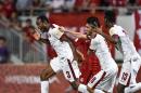 Qatar's Abdelkarim Hassan (L) celebrates after scoring a goal during the 2018 World Cup football qualifying match between Qatar and Hong Kong in Hong Kong on September 8, 2015