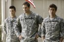 This undated publicity photo released by Fox shows, from left, Parker Young, Geoff Stults and Chris Lowell, starring in the comedy 
