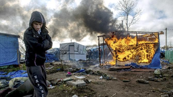 French authorities demolish a makeshift shelter at the &#39;Jungle&#39; migrant camp in the French port city of Calais