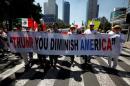 Demonstrators hold a banner during a march to protest against U.S. President Donald Trump's proposed border wall, and to call for unity, in Mexico City, Mexico