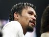 Manny Pacquiao of the Philippines reacts after losing his WBO welterweight title fight against Timothy Bradley Jr. of the U.S. in Las Vegas