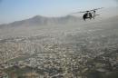 A Blackhawk helicopter flies over Kabul