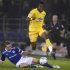 Wilfried Zaha of Crystal Palace hops over a challenge from Andrew Taylor of Cardiff City during their League Cup second leg semi-final at The Cardiff City stadium in Cardiff, Wales