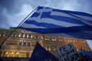 Demonstrators gather during a rally organized by supporters of the YES vote for the upcoming referendum in front of the Greek Parliament in Athens, Tuesday, June 30, 2015. At midnight central Europe-time on Tuesday, the country is set to become the first developed nation to miss a debt repayment to the International Monetary Fund, as Greece sinks deeper into a financial emergency that has forced it put a nationwide lockdown on money withdrawals. (AP Photo/Petros Karadjias)