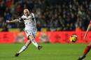 Swansea City's Jonjo Shelvey scores his side's first goal of the game during the English Premier League soccer match at the Liberty Stadium, Swansea, Wales, Tuesday, Jan. 28, 2014. (AP Photo/Nick Potts, PA Wire) UNITED KINGDOM OUT - NO SALES - NO ARCHIVES