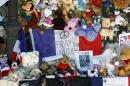Dolls and teddy bears are placed at a memorial in a gazebo on the Promenade des Anglais in Nice, southern France, Wednesday, July 20, 2016. Joggers, cyclists and sun-seekers are back on Nice's famed Riviera coast, a further sign of normal life returning on the Promenade des Anglais where dozens were killed in last week's Bastille Day truck attack. (AP Photo/Claude Paris)