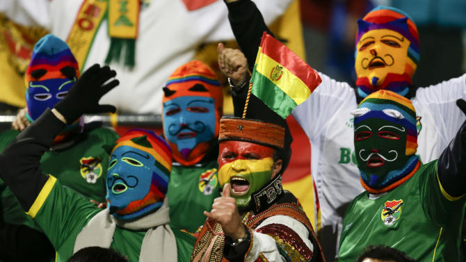 Bolivian fans cheer before the start of a Copa America Group A soccer match between Bolivia and Mexico at the Sausalito Stadium in Vina del Mar, Chile, Friday, June 12, 2015. (AP Photo/Natacha Pisarenko)