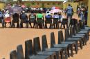 Voters queue to cast their votes at a polling station in Gaberone, Botswana, Friday, Oct. 24, 2014. Electoral officials say that voting has begun without incident where analysts believe the ruling party will win despite growing discontent in urban areas. (AP Photo)