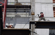 <p>               In this July 9, 2012 photo, construction workers continue work on the job in Boston. U.S. service companies, which employ 90 percent of Americans, grew at a slightly faster pace in July. The Institute for Supply Management reported Friday, Aug. 3, 2012, that its index of non-manufacturing activity picked up slightly last month with a reading of 52.6. That was a tiny improvement from June's reading of 52.1, which had been the lowest since January 2010. Still, any reading above 50 indicates expansion. (AP Photo/Elise Amendola)