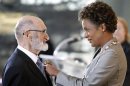 Henry Morgentaler is awarded the rank of Member in the Order of Canada by Governor General Michaelle Jean at the Citadelle in Quebec City in this file photo