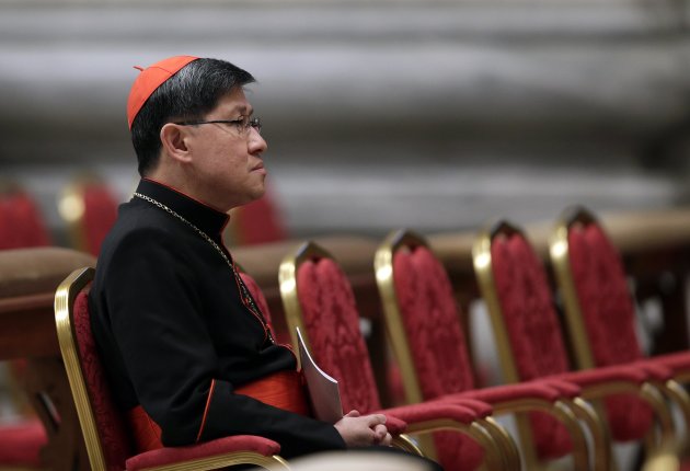 Filipino Cardinal Luis Antonio Tagle attends a prayer at Saint Peter's Basilica in the Vatican March 6, 2013. Catholic cardinals said on Tuesday they wanted time to get to know each before choosing the next pope and meanwhile would seek more information on a secret report on alleged corruption in the Vatican. REUTERS/Max Rossi   (ITALY - Tags: RELIGION)