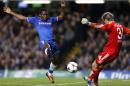 Chelsea's Cameroonian striker Samuel Eto'o (L) blocks the kick of FC Schalke's goalkeeper Timo Hildebrand (R), which rebounded into the net for the opening goal, at Stamford Bridge in London on November 6, 2013