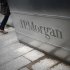 A man walks into the JP Morgan headquarters at Canary Wharf in London