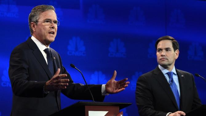Republican presidential hopeful Jeb Bush (L) speaks as Marco Rubio looks on during the CNBC Republican Presidential Debate, October 28, 2015 at the University of Colorado in Boulder