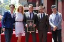 Bryan Cranston and co-stars of "Breaking Bad" pose during ceremonies to unveil Cranston's star on the Hollywood Walk of Fame