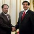 Salahuddin Rabbani, left, head of Afghanistan High Peace Council, shakes hand with Pakistan's Prime Minister Raja Pervaiz Ashraf, for the benefit of the media prior to their meeting in Islamabad, Pakistan, Monday, Nov. 12, 2012. A delegation of Afghanistan High Peace Council headed by Rabbani is in Islamabad to hold talks with Pakistan leadership to discuss peace and the reconciliation process in Afghanistan. (AP Photo/Anjum Naveed)
