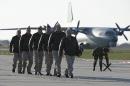 Russian air force pilots walk on the tarmac upon their arrival from Syria at an airbase in southern Russia's Krasnodar region, on March 16, 2016