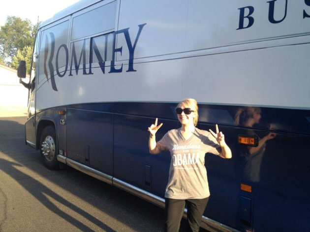 Obama supporter Katie Silva poses in front of Romney?s campaign bus in Reno, Nev. (Katie Silva)