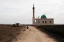 A mosque which used to be a base for Al-Qaeda loyalists of the Islamic State of Iraq and the Levant (ISIS) in seen on the outskirts of the Syrian Kurdish town of Ras al-Ain on November 21, 2013
