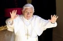 Pope Benedict XVI waves as he arrives to lead his Wednesday general audience at his summer residence of Castel Gandolfo