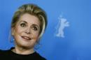 Cast member Deneuve poses during a photocall to promote the movie "Dans La Cour" at Berlinale International Film Festival in Berlin