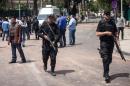 Egyptian security patrols area after bombs struck police posts in Cairo on April 2, 2014