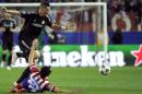 Atletico Madrid's Uruguayan defender Diego Godin (down) vies with Chelsea's Spanish forward Fernando Torres at the Vicente Calderon stadium in Madrid on April 22, 2014