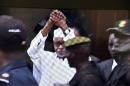 Former Chadian dictator Hissene Habre cried "Allah akbar" (God is greatest) as he was escorted into the Extraordinary African Chambers in Dakar on July 20, 2015 to face charges of crimes against humanity