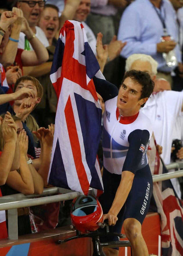 Britain's Geraint Thomas celebrates after winning the track cycling men's team pursuit gold final at the Velodrome during the London 2012 Olympic Games