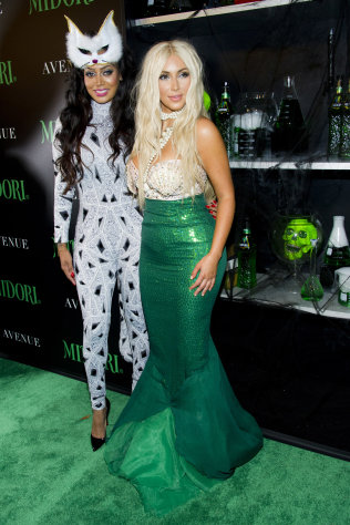 LaLa Anthony, left, and Kim Kardashian attend the 2nd Annual Midori Green Halloween Party on Saturday, Oct. 27, 2012 in New York. (Photo by Charles Sykes/Invision/AP)