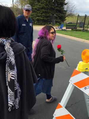 Tyka Nelson holds a rose outside Paisley Park, the …
