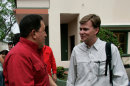 In this June 10, 2007 photo, Venezuela's President Hugo Chavez speaks with AP reporter Ian James in San Fernando de Apure, Venezuela. During more than eight years covering Venezuela, James says he has gained more street smarts, become a tougher, more resourceful reporter and developed a deep affection for Venezuela, a country where events often collide in unpredictable and dramatic ways and where a wide gap frequently separates the reality on the street from the socialist-inspired dreams that Chavez has instilled in his followers. (AP Photo/Fernando Llano)