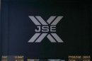 Electronic board displaying movements in major indices is seen at Johannesburg stock exchange in Sandton
