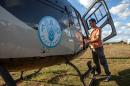 A UN Food and Agriculture Organization (FAO) helicopter equipped with pesticide spreading equipment to fight locusts is pictured after landing at an FAO camp on May 7, 2014 in Tsiroanomandidy, Madagascar