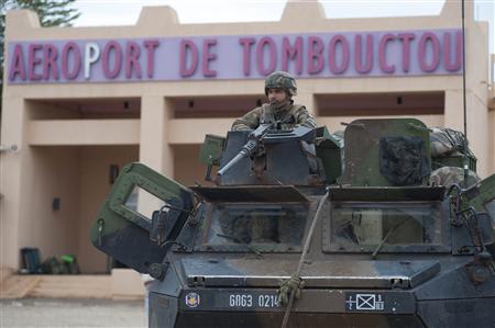 French troops, aboard an armoured vehicle, guard the Timbuktu airport in this January 28, 2013 picture provided by the French Military audiovisual service (ECPAD) January 29, 2013. REUTERS/Arnaud Roine/ECPAD/Handout