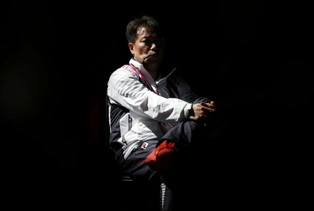 Coach of South Korea's Shin reacts as he waits for the final decision from the judges after Shin's' women's epee individual semifinal fencing competition against Germany's Heidemann at the ExCel venue