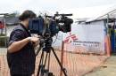 A cameraman films the entrance of the Ebola treatment center in Liberia where NBC cameraman Ashoka Mukpo was being treated for Ebola