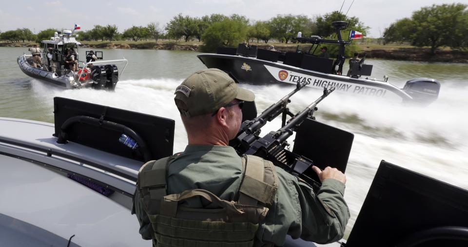 FILE - In this July 24, 2014 file photo, Texas Department of Safety Troopers patrol on the Rio Grand along the U.S.-Mexico border, in Mission, Texas. ...
