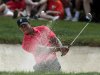 Tiger Woods of the U.S. hits from the sand on the 10th hole during the final round of the Memorial Tournament in Dublin, Ohio