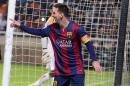 Barcelona's Lionel Messi celebrates after scoring against Apoel during the Champions League Group F soccer match between Apoel and Barcelona , at GSP stadium, in Nicosia, Cyprus, Tuesday, Nov. 25, 2014. (AP Photo/ Philippos Christou)