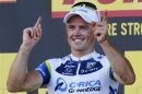 Orica Greenedge team rider Simon Gerrans of Australia celebrates his victory on the podium of the 145,5 km third stage of the centenary Tour de France cycling race from Ajaccio to Calvi