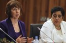 EU foreign policy chief Catherine Ashton speaks with Cyprus' Foreign Minister Erato Kozakou-Marcoullis during a news conference in Paphos