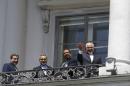 Iranian Foreign Minister Zarif, Araghchi and Fereydoon stand on the balcony of Palais Coburg, the venue for nuclear talks in Vienna