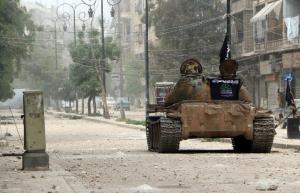 A tank belonging to the rebel Islamic Front on a street …