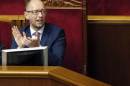 Ukraine's Prime Minister Yatseniuk reacts during a session of the parliament in Kiev