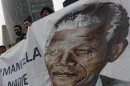 Well-wishers participate in a celebration to mark Mandela's 95th birthday at the Angel de la Independencia monument in Mexico City
