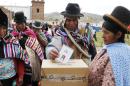 An Aymara Indian casts his ballot at a voting center during the constitution referendum in Jesus de Machaca, Bolivia, Sunday, Feb. 21, 2016. Bolivians are voting in a referendum on whether to amend the constitution so that President Evo Morales can run in 2019 for a fourth consecutive term.(AP Photo/Juan Karita)