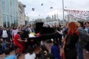 Pianist Martello of Germany is surrounded by anti-government protesters as he performs at Taksim square in central